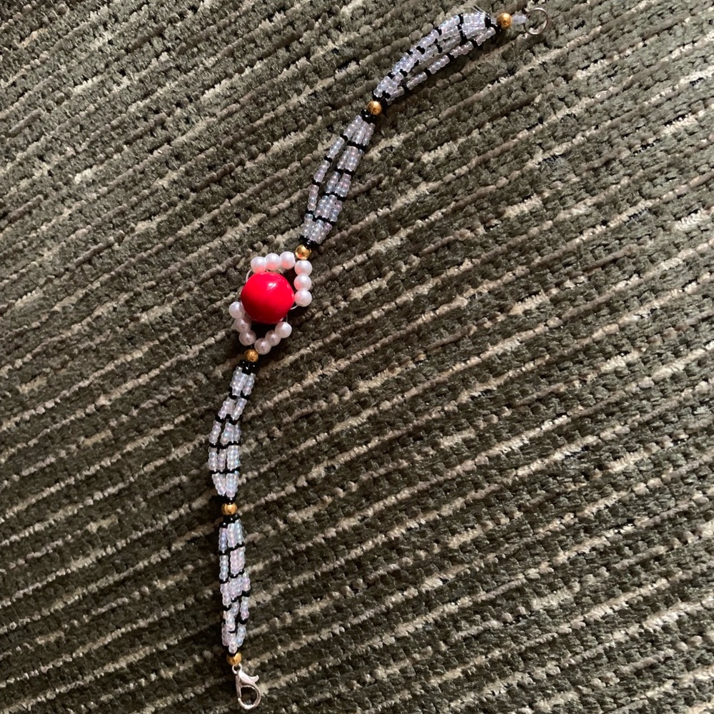 Elegant Beaded Bracelet with Red Accent